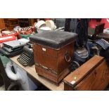 An early 20th century hammered copper coal box seat