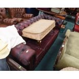 An ox-blood leather chesterfield sofa