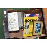 A box of books including boxing reference