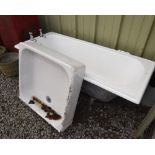 A cast iron bath; tog. with a ceramic shower tray