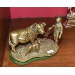 A brass group of bull, farmer and dog