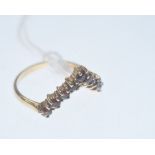A 9ct gold garnet "wishbone" ring.