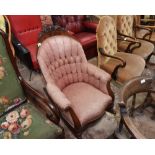 A 19th century French button backed mahogany framed rocking chair