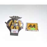 Two AA car badges