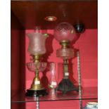 Two 19th century oil lamps, one with brass base, the other cast iron (2)