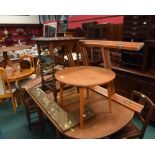 A group of furniture comprising an oak extending dining table, a console table and an occasional