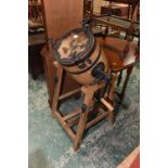 A pitch pine framed coopered butter churn on stand with cast iron mounts