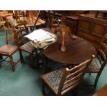 A set of three 1930s oak chairs, an oak extending table and a set of four ladder back chairs (8)