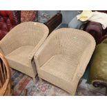 A pair of wicker tub chairs