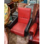 A 1950s red and black leather Deco style armchair