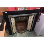 A fire inset; tog. with a tiled fire surround