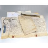 A large group of 18th and 19th century deeds and indentures.