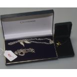 A 9ct gold dolphin pendant and chain tog. with a silver necklace and a silver bracelet (3)