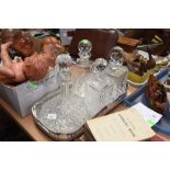 A pair of cut glass decanters, a ship's decanter and another (4)