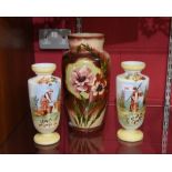 A pair of Victorian painted opaque glass vases, tog. with another. largest 35cm