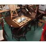 An oak dining table; tog,. with four Windsor type chairs and an occasional table, a bamboo planter