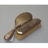 Two silver backed dressing table brushes, both marked for Birmingham