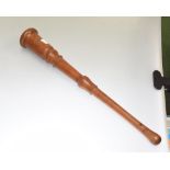A 19th century turned fruitwood truncheon or long priest, of tapering form, lead weighted. 47cm