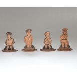 A group of four carved and wooden cut out cartoon figures of World War II military figures inc.