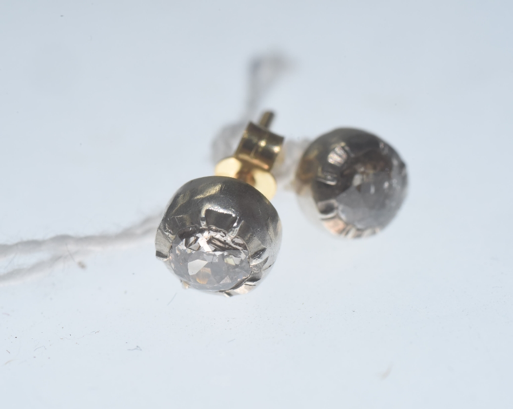 A pair of diamond ear studs, the round brilliant-cut stones totalling c. 0.70 carats, on post and