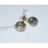 A pair of diamond ear studs, the round brilliant-cut stones totalling c. 0.70 carats, on post and