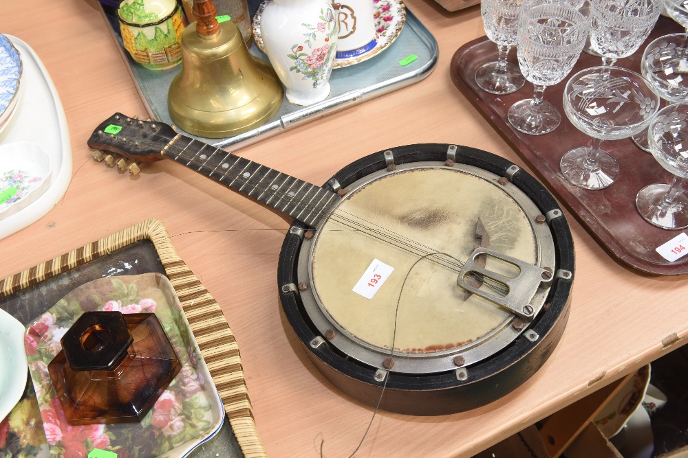 An early 20th century eight string banjo with ebonised and rosewood case (a/f)