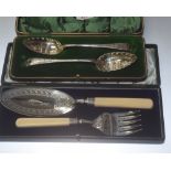 A pair of 19th century cased silver-plated berry spoons; together with a cased pair of ivory-handled