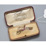 A 1950's 9ct gold brooch set with seed pearls and coloured stones, cased.