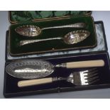 A pair of 19th century cased silver-plated berry spoons; together with a cased pair of ivory-handled