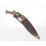 A mid 20th century khukuri, the blade engraved Qeycom Bros. 1944 in original leather scabbard, the