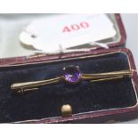 An Edwardian 9ct gold amethyst set bar brooch, cased