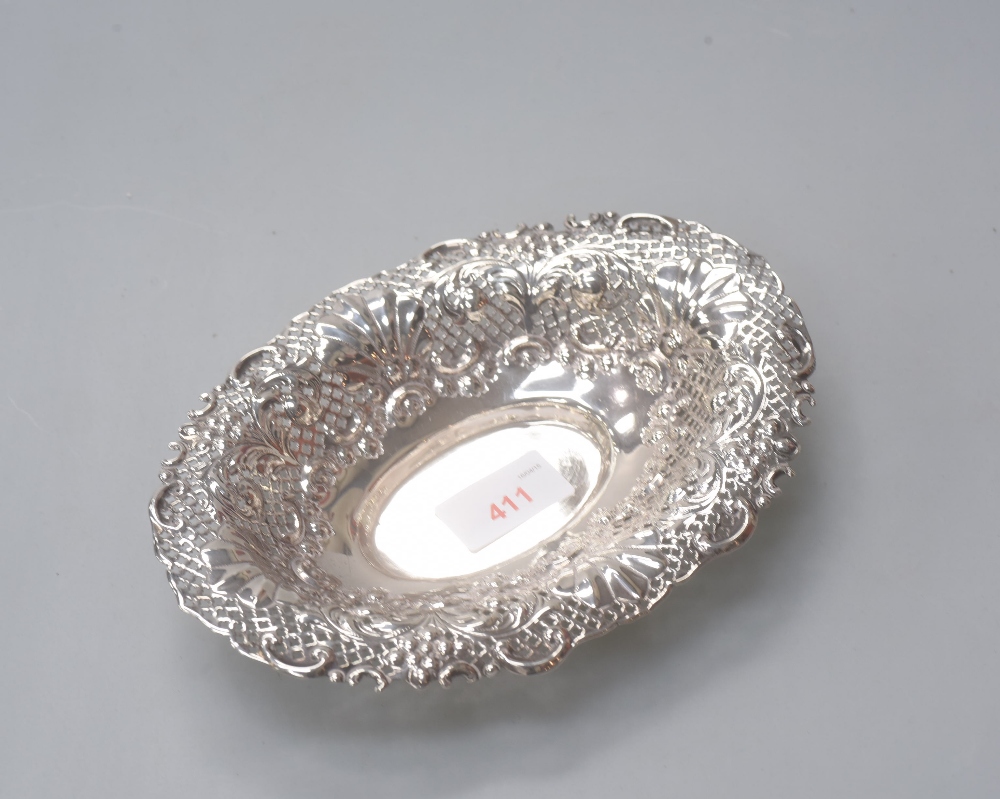 A silver bon bon dish of oval form with pierced rim with foliate and shell decoration,  Edinburgh