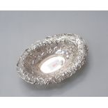 A silver bon bon dish of oval form with pierced rim with foliate and shell decoration,  Edinburgh