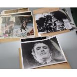 A quantity of movie stills inc. Dracula, James Bond etc