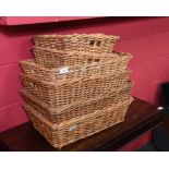 A set of seven wicker baskets