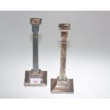 A pair of silver candlesticks, of tapering square form, London 1933, makers mark for The British