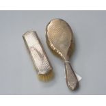 Two silver backed dressing table brushes, both marked for Birmingham