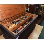 A 19th century painted pine blanket box converted to a tool chest and containing vintage planes,