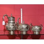 A three piece silver plate tea service, tea, coffee and sugar.