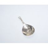 A George III silver caddy spoon, with engraved bowl and bright cut edged handle,  London 1789,