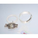 A silver fish-form teething ring; tog. with a silver christening bracelet marked for Sheffield 1977