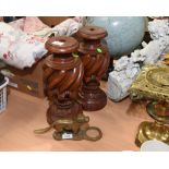 A pair of carved wooden table lamps (fittings lacking); tog. with a vintage nut cracker