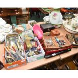 Three trays containing a quantity of costume jewellery, flatware, lizard skin jewellery box etc