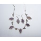 A pair of Mexican silver earrings set with unpolished amethyst tog. with a pendant en suite