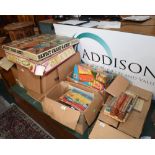 Five boxes containing a large quantity of vintage games and toys, c. 1960