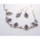 A pair of Mexican silver earrings set with unpolished amethyst tog. with a pendant en suite