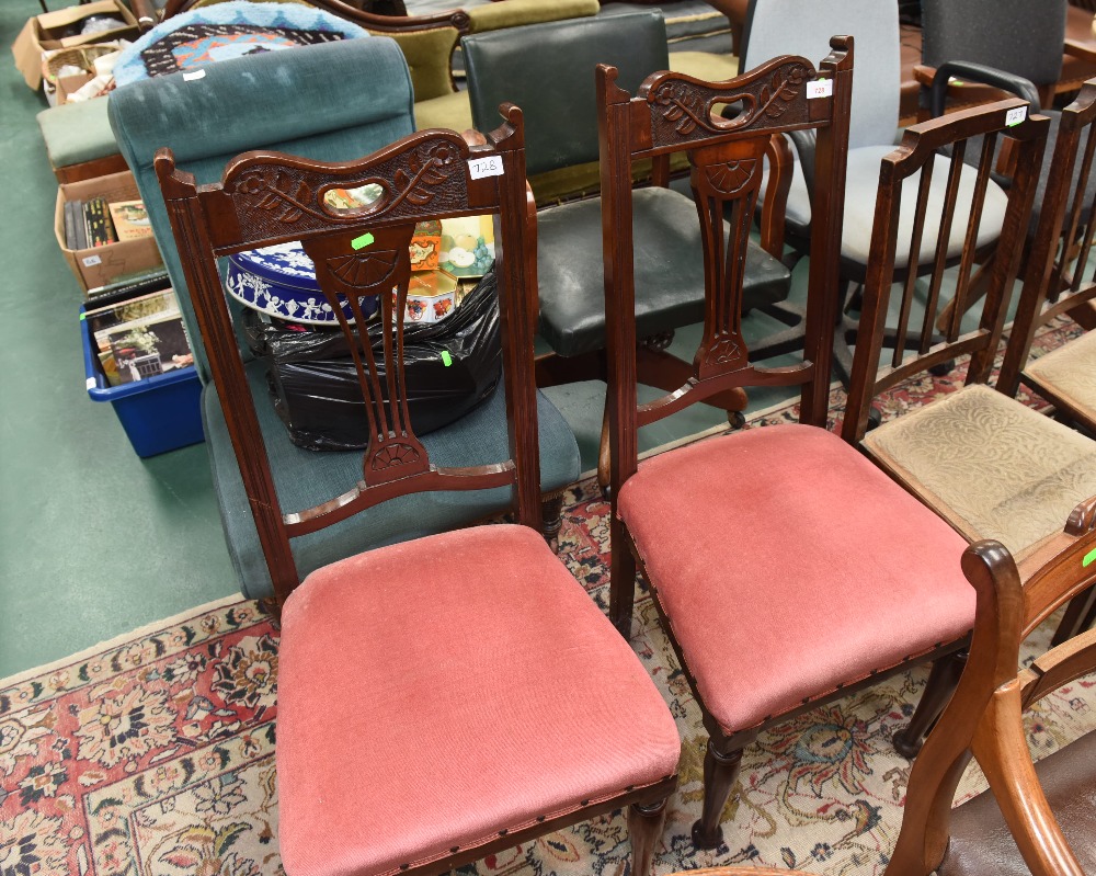 A pair of carved mahogany dining chairs