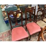 A pair of carved mahogany dining chairs