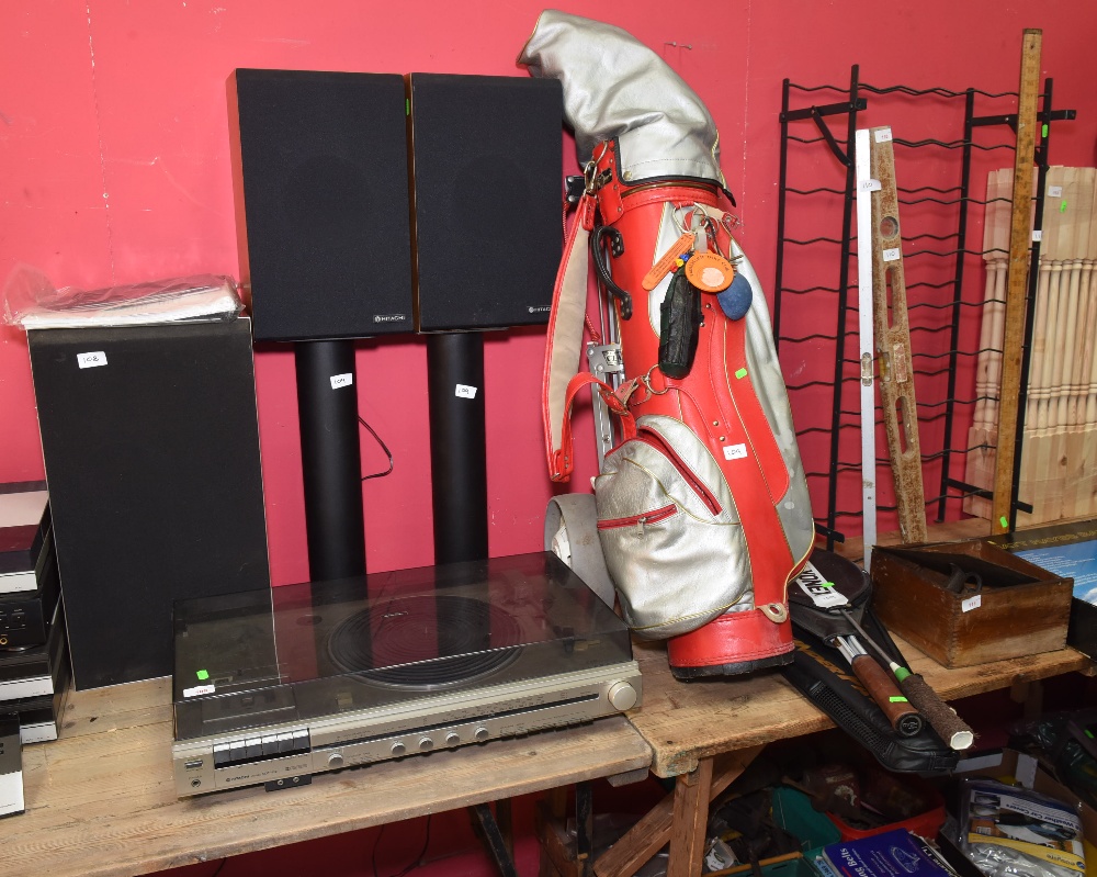 A Hitachi deck; tog. with a pair of speakers and golf bag an clubs, tennis racket etc