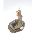 A Border Fine Art figure of a Sportsman with two labradors at their peg, designed by Ayres